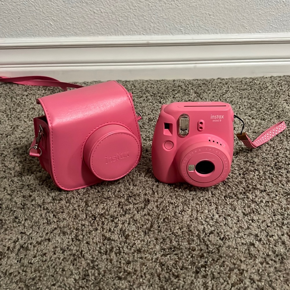 pink polaroid camera and case